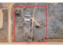 An aerial view of the home with other various outbuildings on a large expansive lot at 14624 County Road 12, Fort Lupton, CO 80621