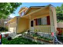 Quaint front porch with a decorative garden bed adds character to this lovely two-story home at 5241 E 128Th Way, Thornton, CO 80241