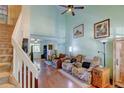 Spacious living room with high ceilings, hardwood floors, and a comfortable seating area at 5241 E 128Th Way, Thornton, CO 80241