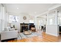 Open living space with hardwood floors, fireplace, and seamless flow to dining area at 452 N Finch Ave # 452B, Lafayette, CO 80026