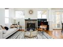 Cozy living room showcasing a fireplace, modern decor, and large windows at 452 N Finch Ave # 452B, Lafayette, CO 80026