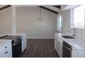 Modern kitchen with stainless steel appliances and island at 6769 W Fair Dr, Littleton, CO 80123