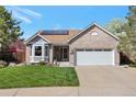 Charming single-Gathering home showcasing a well-manicured lawn, complemented by a brick and gray color scheme at 2533 W 110Th Ave, Westminster, CO 80234