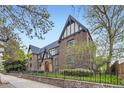 Classic brick apartment building showing Tudor style and well-maintained landscaping at 2233 Kearney St # 19, Denver, CO 80207
