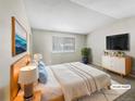 Serene primary bedroom with neutral colors, plush bedding, and stylish furnishings, designed for relaxation at 18945 E 45Th Ave, Denver, CO 80249