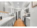 Efficient kitchen with sleek appliances and ample counter space for culinary creativity at 1090 E 3Rd Ave, Denver, CO 80218