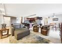 Cozy living room features open concept to kitchen and dining room, natural light, and modern finishes at 2 Adams St # 705, Denver, CO 80206