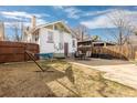Spacious backyard with a patio area, perfect for outdoor dining and relaxation, surrounded by a wooden fence at 3942 Alcott St, Denver, CO 80211