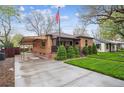 Lovely brick home with carport, well maintained lawn and professional landscaping at 2989 S Corona St, Englewood, CO 80113