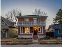 Charming two-story brick home with a spacious front porch and second story balcony at 2519 N Gilpin St, Denver, CO 80205