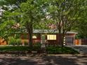 Charming brick home with mature trees, well-maintained landscaping, and inviting curb appeal at 10109 W 68Th Ave, Arvada, CO 80004