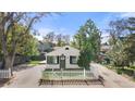 Charming home featuring a white picket fence and well-manicured landscaping at 3925 Pecos St, Denver, CO 80211