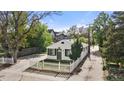 Charming home featuring a white picket fence and well-manicured landscaping at 3925 Pecos St, Denver, CO 80211