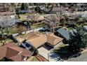 Aerial view of a single-Gathering home with a fenced backyard and mature trees at 2424 S Jasmine St, Denver, CO 80222