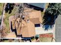 Overhead shot of the home's roof, driveway, and well-manicured lawn at 2424 S Jasmine St, Denver, CO 80222