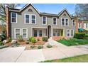 Inviting townhome exterior with well-maintained landscaping and charming curb appeal on a sunny day at 1150 Inca St # 25, Denver, CO 80204