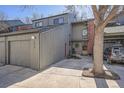 Gray two-story house with a two-car garage with a brick chimney and landscaping at 1513 48Th St # 7, Boulder, CO 80303