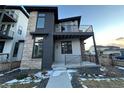 Modern home exterior with stone and gray siding at 6060 N Perth St, Aurora, CO 80019