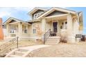 Quaint home featuring craftsman-style architecture with separate entrances and a cozy front porch at 4893 Newton St, Denver, CO 80221