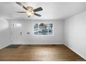 Bright and airy living room with hardwood floors and lots of natural light at 4620 W Alaska Pl, Denver, CO 80219
