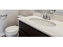 Modern bathroom with a stylish vanity, granite countertop, and contemporary fixtures at 14412 Heritage Dr, Mead, CO 80504