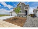 Charming two-story home with well-maintained landscaping, creating a welcoming curb appeal at 14412 Heritage Dr, Mead, CO 80504