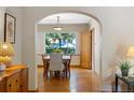 Inviting dining room featuring hardwood floors, a wood table set, and a view to the backyard at 1040 S Elizabeth St, Denver, CO 80209