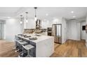 Modern kitchen with stainless steel appliances and an island at 925 N Lincoln St # 6F, Denver, CO 80203