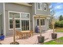Outdoor patio with dining table and chairs, ideal for entertaining and relaxation at 6379 Holman Ct, Arvada, CO 80004