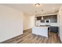 Modern kitchen featuring an island, stainless steel appliances, and sleek countertops at 370 N. Geneva St, Aurora, CO 80010
