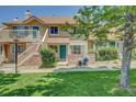 Charming townhome with a well-manicured lawn and an inviting entryway at 2181 S Troy Way # 103, Aurora, CO 80014