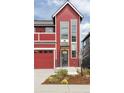 A modern-style two-story red home with a front entrance featuring stylish accents at 285 Clementina St, Louisville, CO 80027