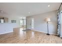 Open concept living room with wood floors and recessed lighting at 3727 Cactus Creek Ct # 204, Highlands Ranch, CO 80126
