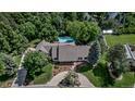 Stunning aerial view of the estate featuring a sparkling pool and lush landscaping at 17 E Belleview Ln, Greenwood Village, CO 80121