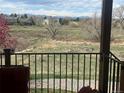 Scenic backyard view with lush greenery and distant mountain peaks at 6340 Ashburn Ln, Highlands Ranch, CO 80130