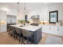 Bright, spacious kitchen featuring a large island with seating and stainless steel appliances at 3149 W 35Th Ave, Denver, CO 80211