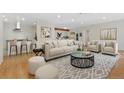 Bright open concept living room flows seamlessly into the kitchen, perfect for modern living at 1777 Larimer St # 608, Denver, CO 80202