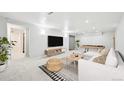 Spacious basement with a large entertainment area and comfortable seating at 8307 E Lehigh Dr, Denver, CO 80237