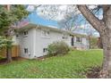 Well maintained one-story home featuring a freshly painted exterior and manicured lawn at 8307 E Lehigh Dr, Denver, CO 80237