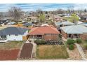 Aerial view of a lovely home in a quiet neighborhood with mature trees and well-kept lawns at 3670 Ivanhoe St, Denver, CO 80207