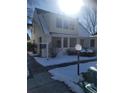 Front view of a 2-story house with a snow covered yard at 230 S 22Nd Ave, Brighton, CO 80601