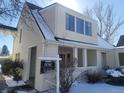 View of a 2-story house, for sale, snow on ground at 230 S 22Nd Ave, Brighton, CO 80601