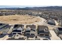 Wide aerial shot of a residential area with a mix of modern homes and community spaces at 8211 Monte Vista Cir, Littleton, CO 80125