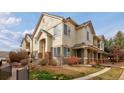 Charming townhome exterior with well-maintained landscaping and a welcoming entrance at 22675 E Ontario Dr # 202, Aurora, CO 80016