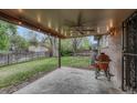 Outdoor patio featuring a ceiling fan and grilling area, ideal for entertaining guests at 17390 E Greenwood Cir, Aurora, CO 80013