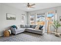 Bright living room with large windows providing ample natural light and comfortable seating at 27857 E 8Th Ave, Aurora, CO 80018