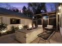 Backyard fire pit with an outdoor television and comfortable seating at 1291 S Gaylord St, Denver, CO 80210