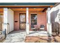 Inviting front porch with brick accents and seating area at 449 N Pearl St, Denver, CO 80203