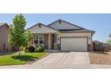 Inviting home with well-maintained landscaping, a two-car garage, and neutral exterior colors at 398 Midden Pl, Castle Rock, CO 80104