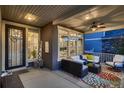 Inviting front porch with stylish seating, perfect for enjoying the outdoors at 4965 Malaya St, Denver, CO 80249